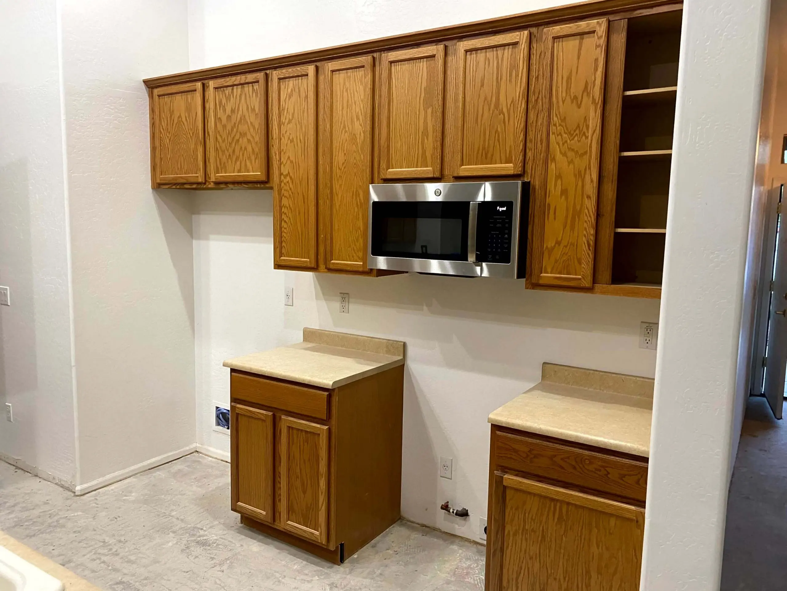 Original wood kitchen cabinets before painting by Butcher’s Custom Painting in Peoria, AZ