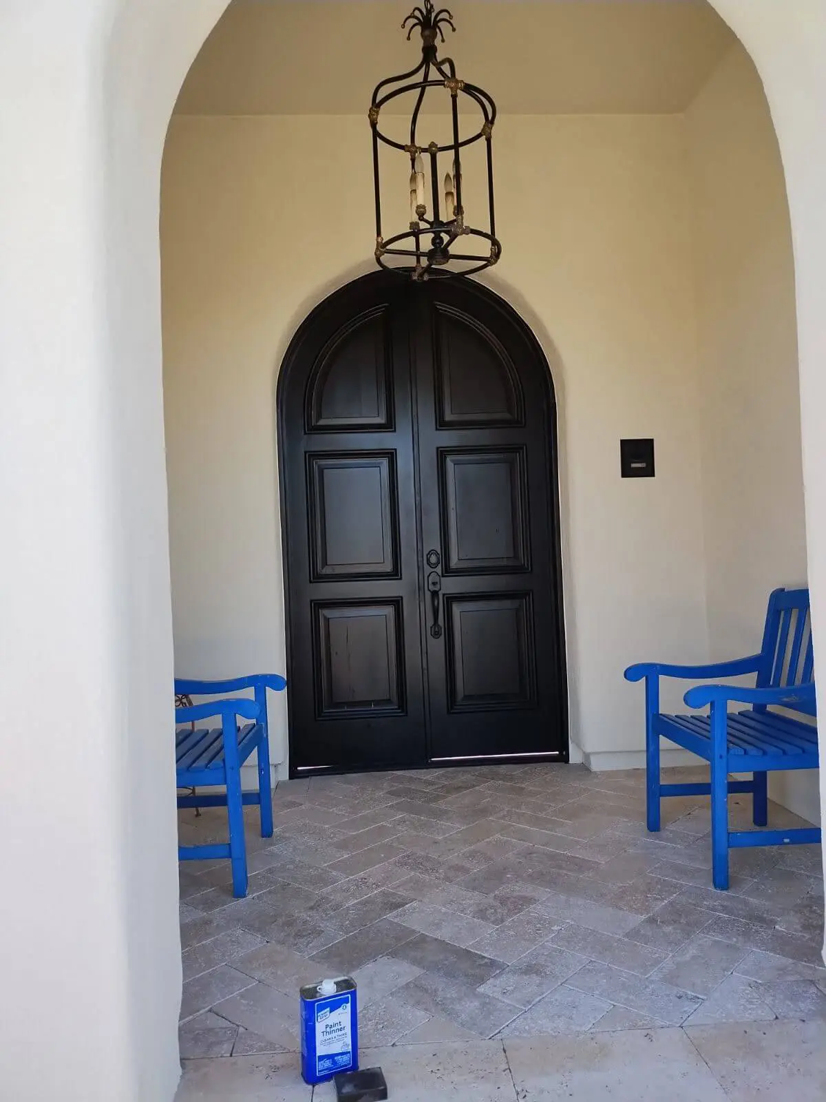 Elegant arched front door refinishing and entryway painting project completed by Butcher's Custom Painting.