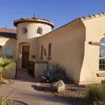 A Spanish-style stucco home exterior in Peoria, Arizona showing the type of surface elastomeric coating is designed to protect.