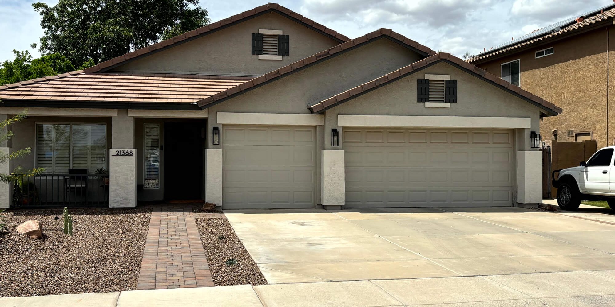 Modern Arizona residence showcasing a professional exterior stucco and trim paint project by Butcher's Custom Painting.