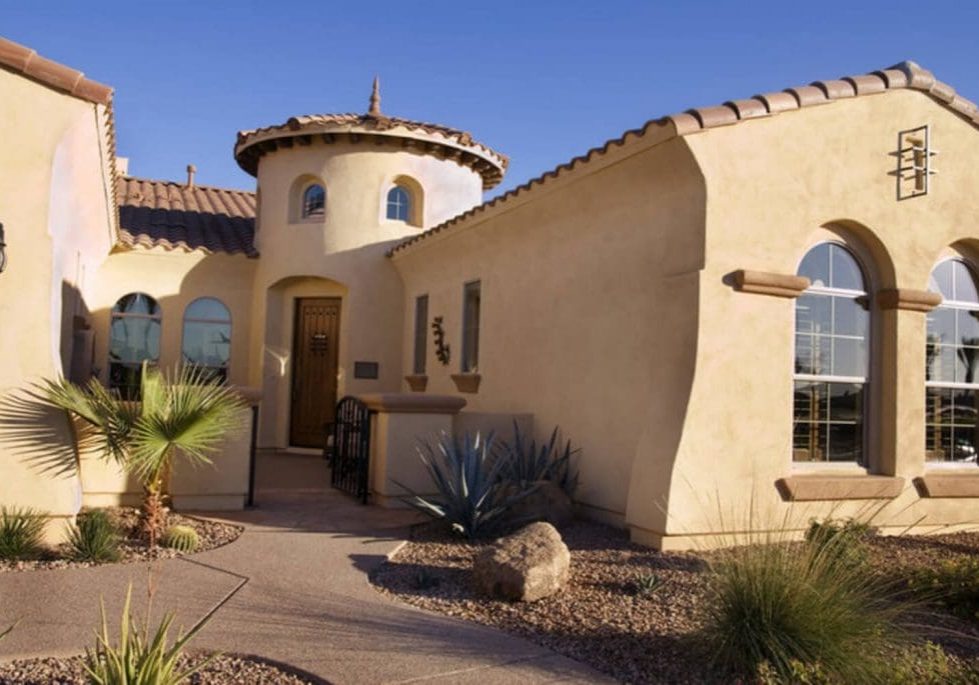 A Spanish-style stucco home exterior in Peoria, Arizona showing the type of surface elastomeric coating is designed to protect.